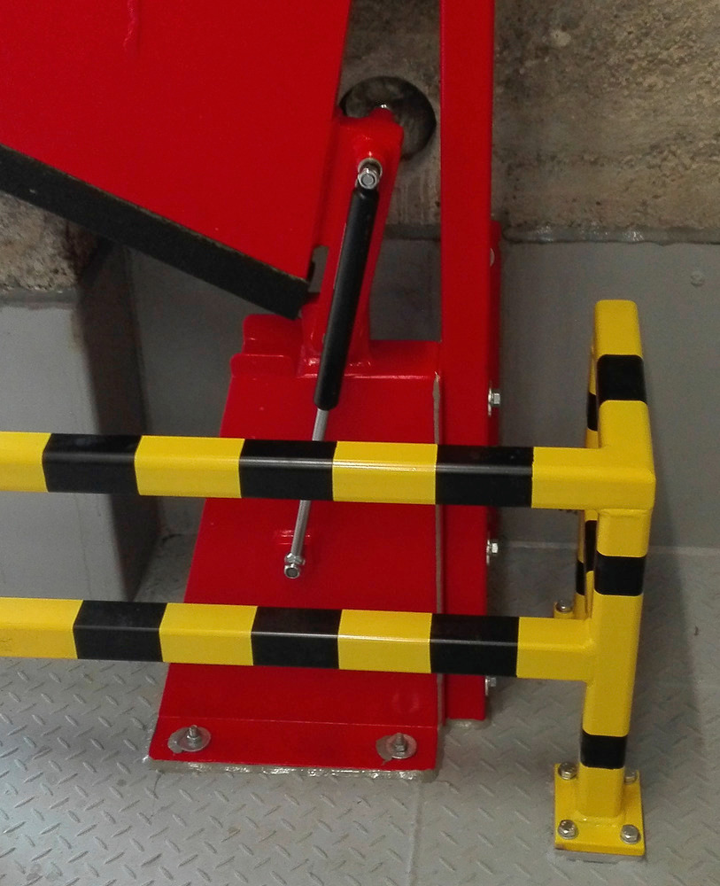 Gas-filled shock absorber for rotatable barriers